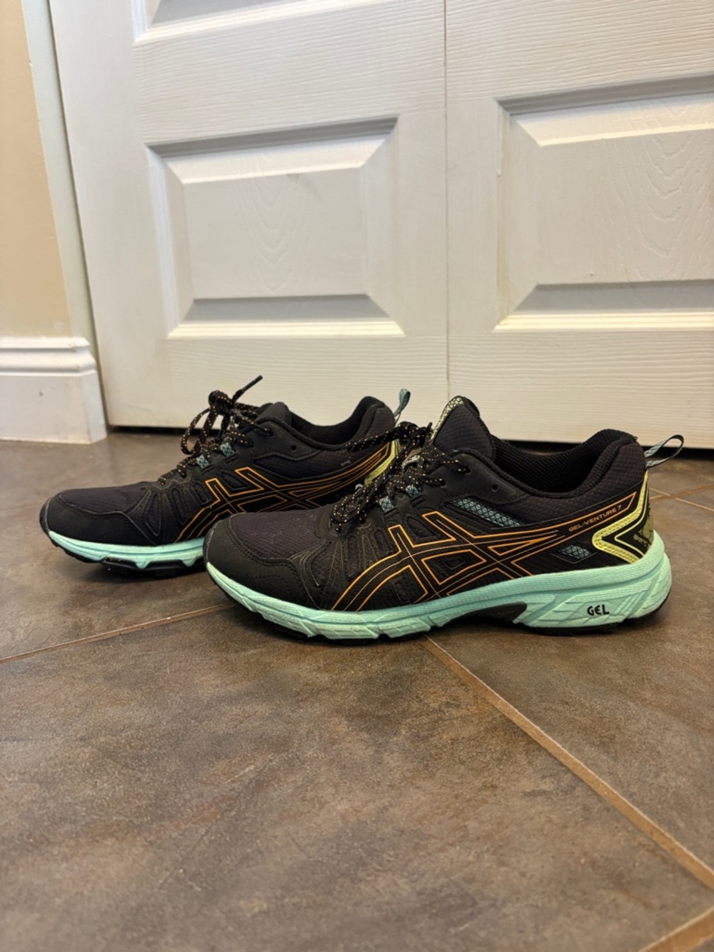 Asics Black Running Shoes with Mint Green Sole and Gold Accents
